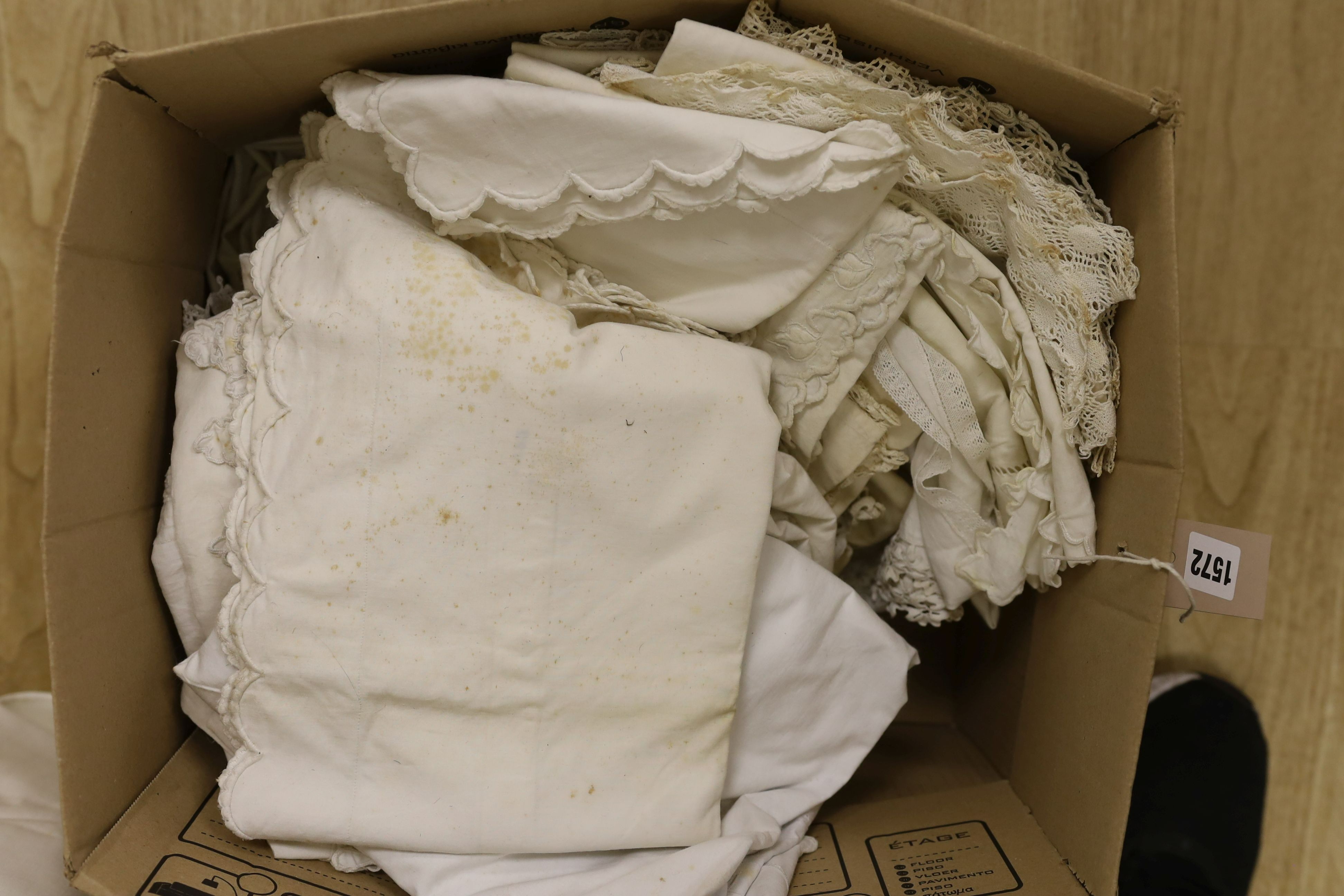 A large quantity of embroidered pillow cases